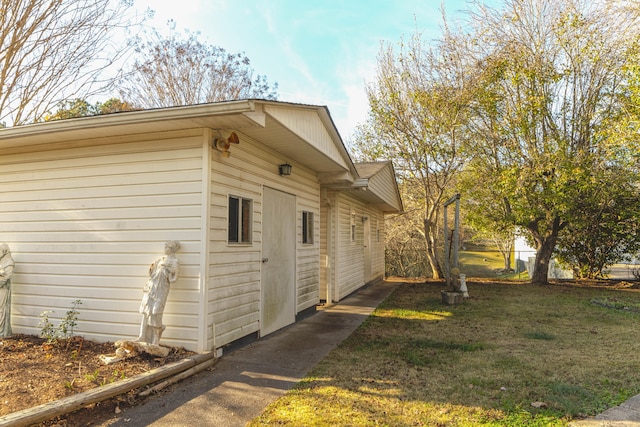 view of home's exterior with a lawn