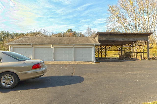 garage featuring a carport