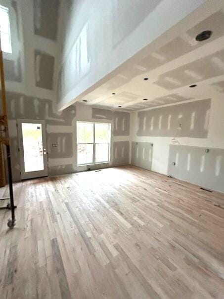 unfurnished living room with hardwood / wood-style flooring