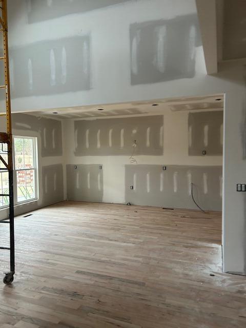 spare room featuring hardwood / wood-style floors