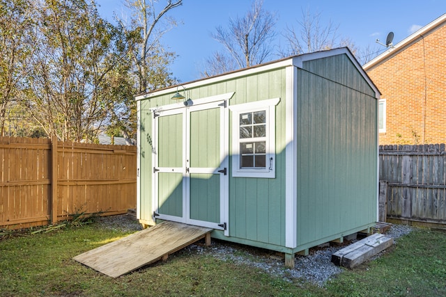 view of outbuilding with a yard