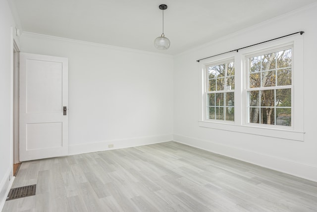 unfurnished room with light wood-type flooring and ornamental molding