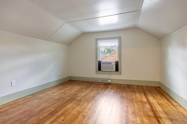 bonus room with cooling unit, wood-type flooring, and lofted ceiling