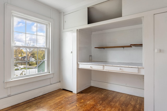 interior space featuring dark wood-type flooring and a baseboard radiator