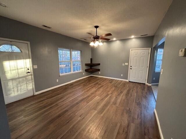 foyer entrance featuring ceiling fan and dark hardwood / wood-style flooring