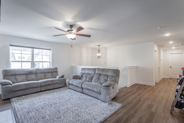 living room with hardwood / wood-style flooring and ceiling fan