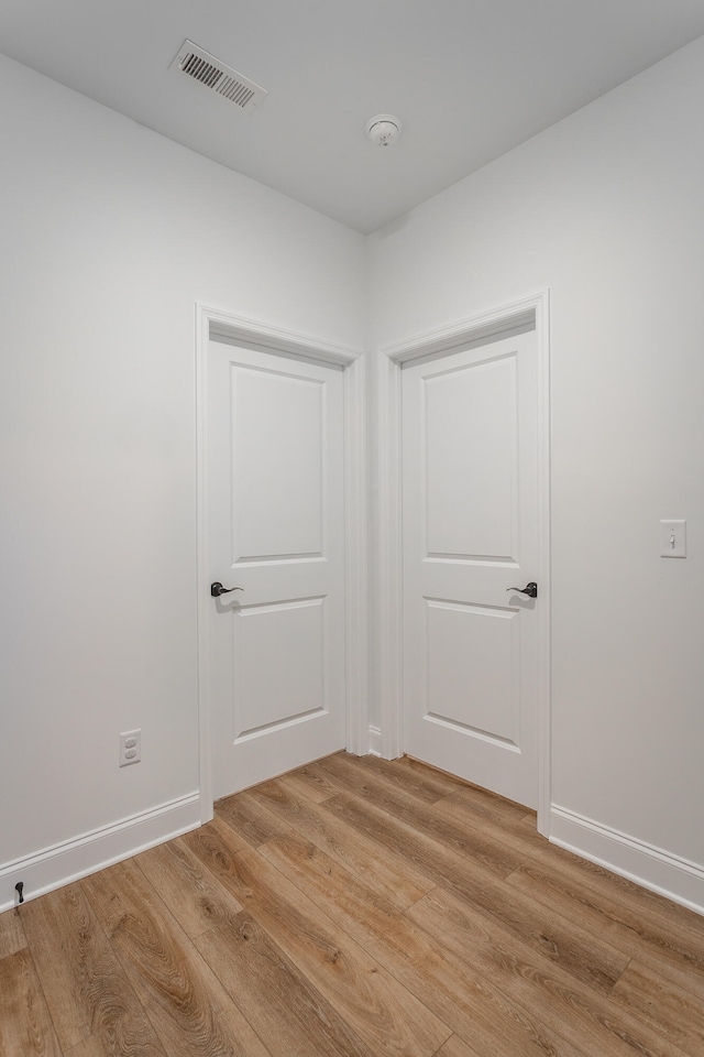 unfurnished room featuring light hardwood / wood-style floors