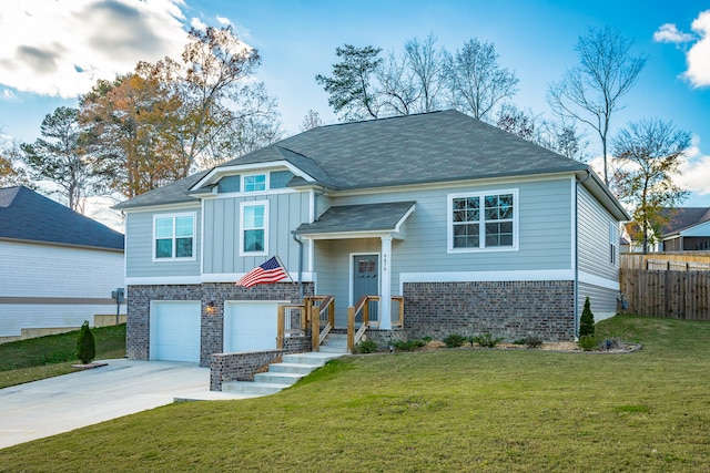 view of front of home featuring a garage and a front yard