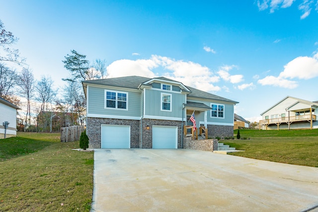 view of front of home with a garage and a front yard