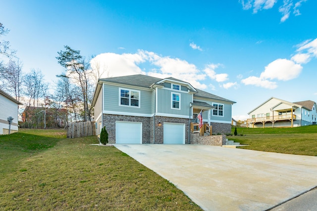 view of front of property featuring a front lawn and a garage