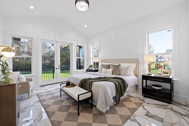 bedroom featuring lofted ceiling, french doors, access to outside, and multiple windows