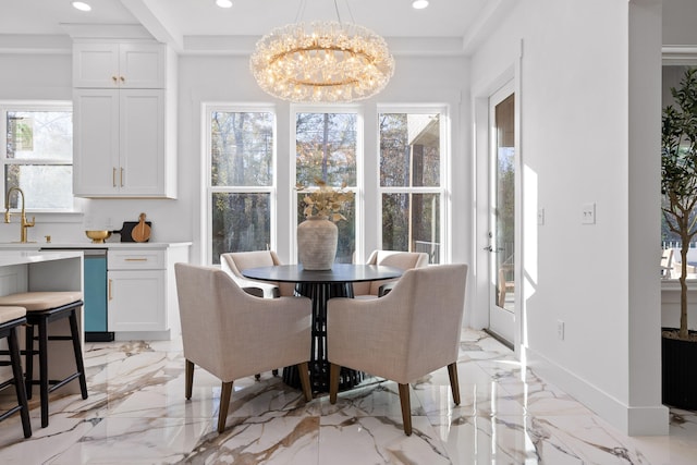 dining room featuring an inviting chandelier and sink