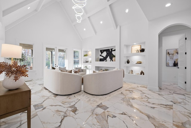 living room featuring beam ceiling, built in features, and high vaulted ceiling