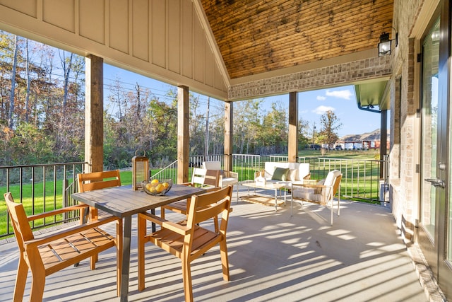 sunroom / solarium with lofted ceiling