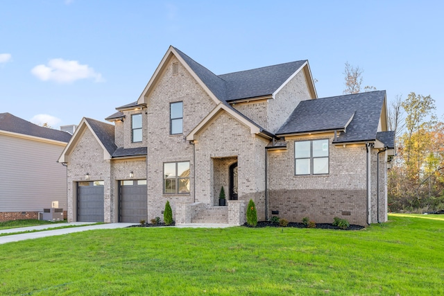 view of front of house featuring a garage, a front lawn, and cooling unit