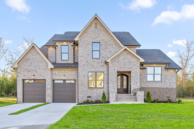 view of front facade featuring a front lawn, a garage, and french doors