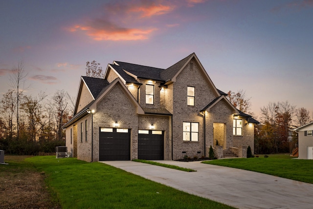 view of front facade featuring a lawn and a garage