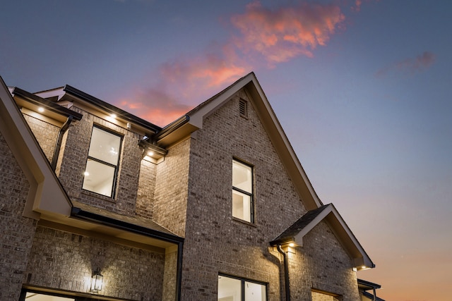 view of property exterior at dusk