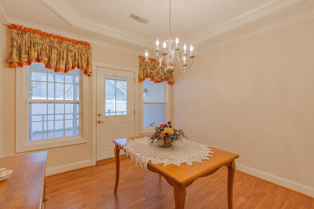 6315 Laramie Cir, Chattanooga, TN 37421 - dining space featuring a chandelier, light wood finished floors, ornamental molding, and baseboards