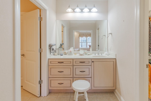 bathroom featuring tile patterned flooring and vanity