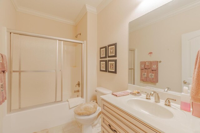 6315 Laramie Cir, Chattanooga, TN 37421 - bathroom with crown molding, vanity, toilet, tile patterned floors, and shower / bath combination with glass door