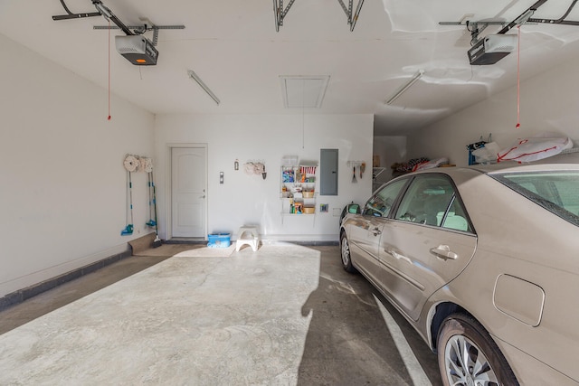 garage featuring electric panel and a garage door opener