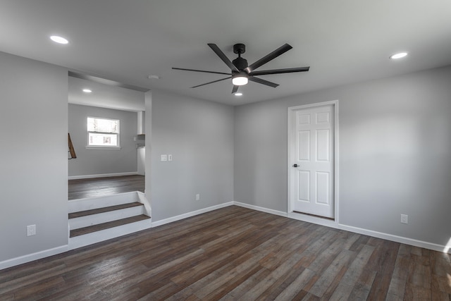 unfurnished room with ceiling fan and dark hardwood / wood-style flooring