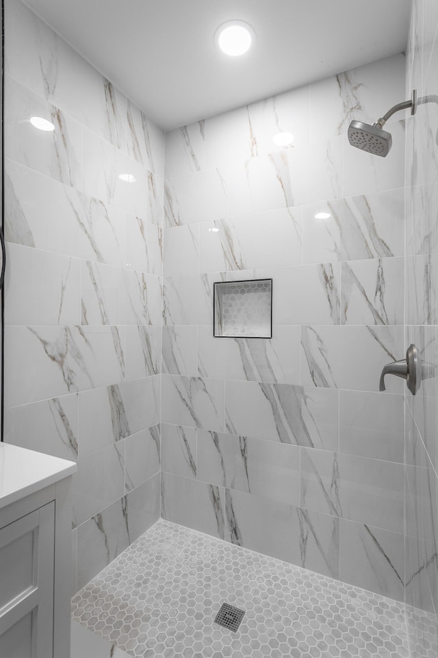 bathroom with tiled shower