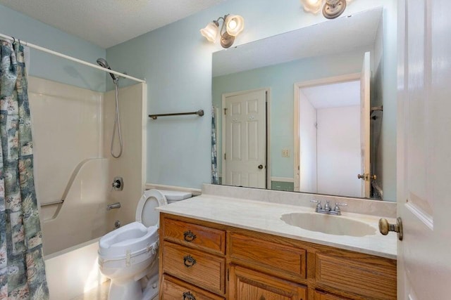 full bathroom featuring shower / bath combo, vanity, a textured ceiling, and toilet