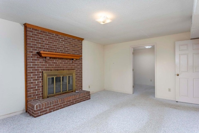 unfurnished living room with light colored carpet, a textured ceiling, and a brick fireplace