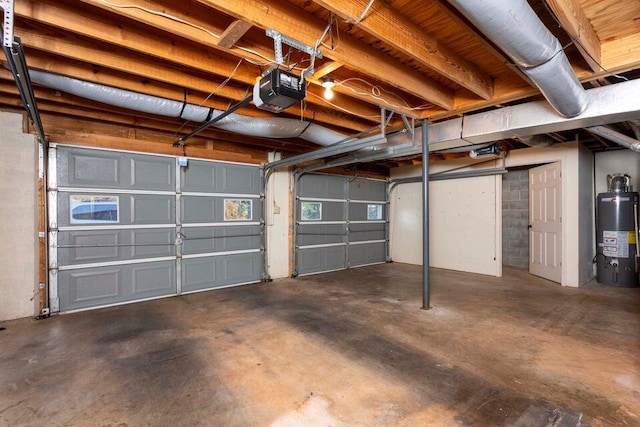 garage featuring gas water heater and a garage door opener