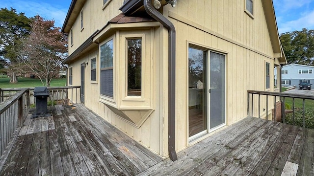 wooden deck featuring grilling area