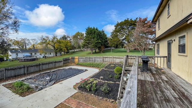 view of pool featuring a wooden deck and a patio area