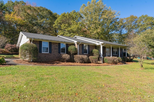 ranch-style home with a front lawn