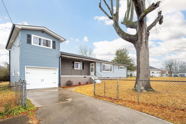 view of front of home with a garage and a front lawn