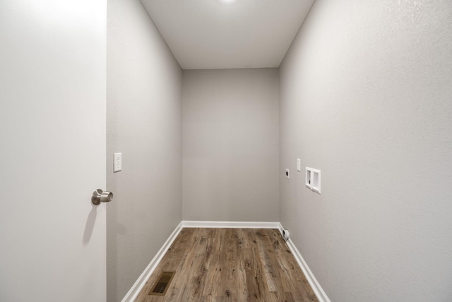 laundry room featuring hookup for a washing machine, wood-type flooring, and hookup for an electric dryer