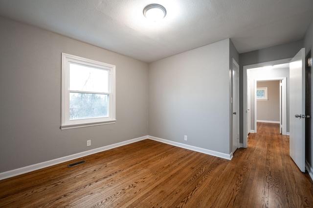 empty room featuring hardwood / wood-style floors