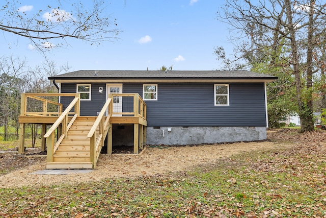 back of house with a wooden deck