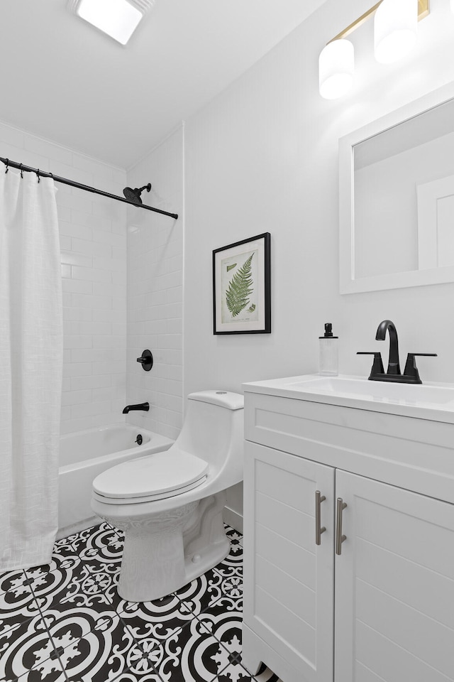 full bathroom featuring tile patterned flooring, shower / tub combo, vanity, and toilet