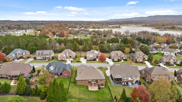 birds eye view of property with a mountain view