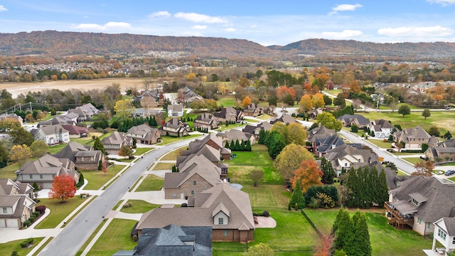 birds eye view of property with a mountain view