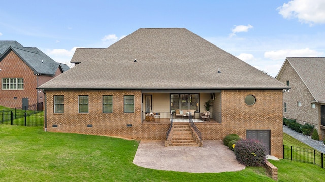 rear view of house with a patio area and a yard