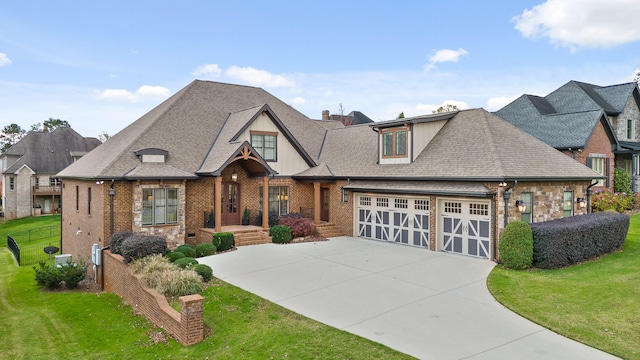 view of front of house with a front yard and a garage