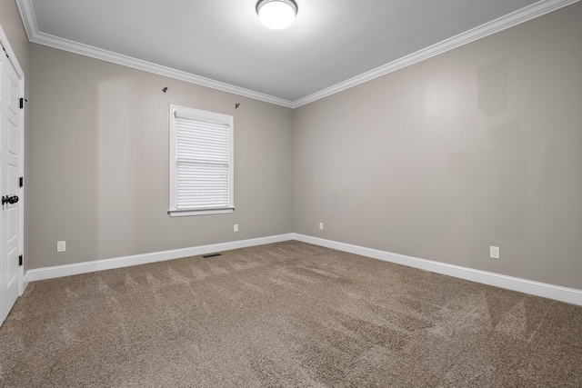 carpeted spare room featuring crown molding