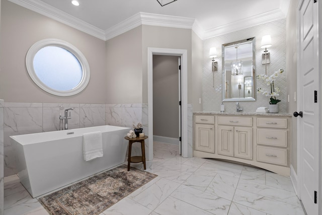 bathroom with a tub to relax in, vanity, tile walls, and ornamental molding