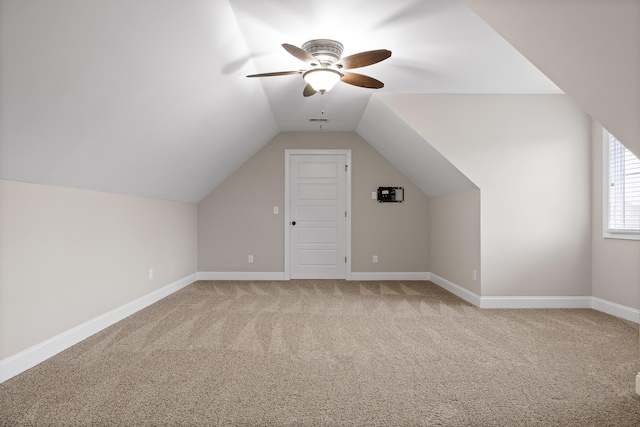 bonus room featuring ceiling fan, carpet, and lofted ceiling