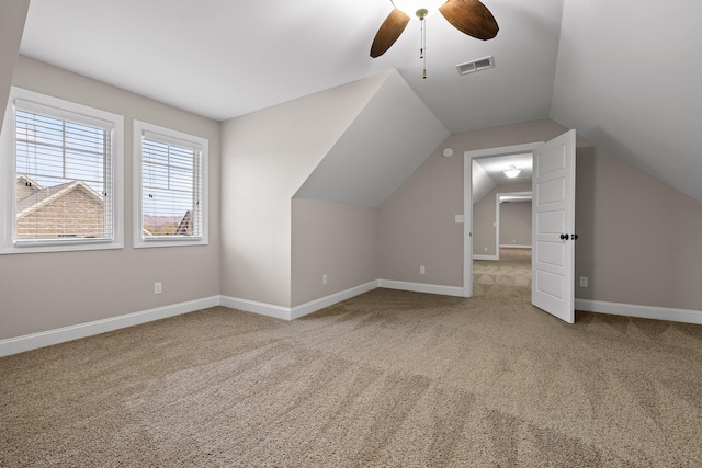 bonus room with ceiling fan, carpet floors, and vaulted ceiling