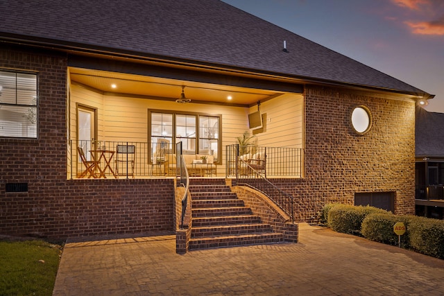 exterior entry at dusk with a porch