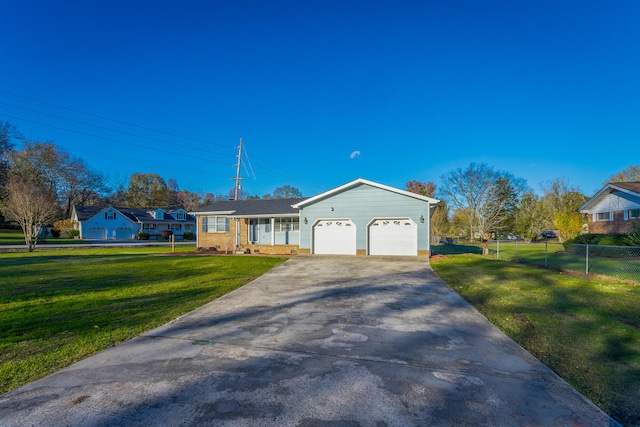 single story home featuring a front yard and a garage