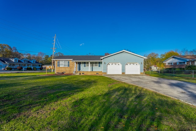 single story home featuring a garage and a front yard